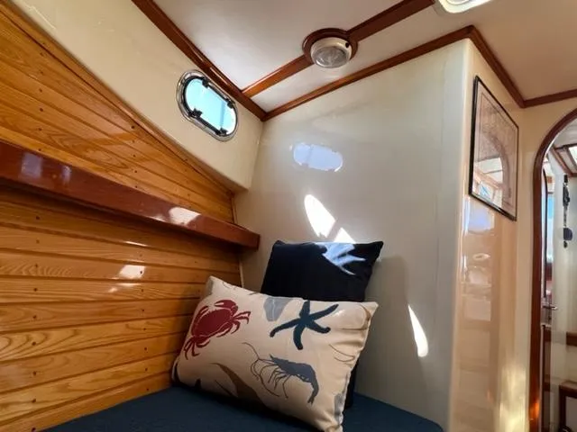 Slide: The Image of Interior of 2000 Duffy 35 Hardtop Cruiser with nautical decor. - 16