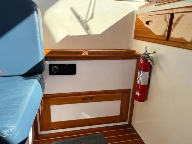 Slide: The Image of Interior of a 2000 Duffy 35 Hardtop Cruiser with fire extinguisher. - 17