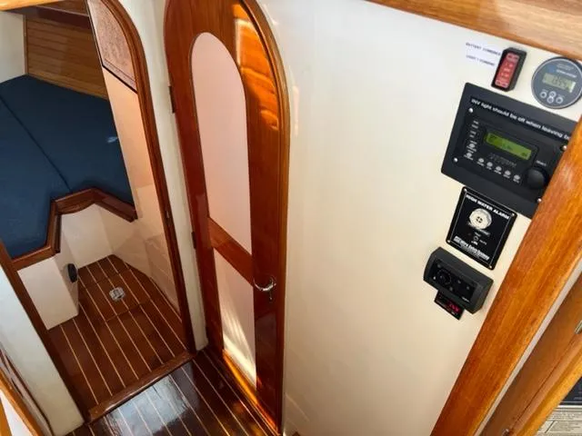 Slide: The Image of Interior of 2000 Duffy 35 Hardtop Cruiser with wooden doors and control panel. - 20