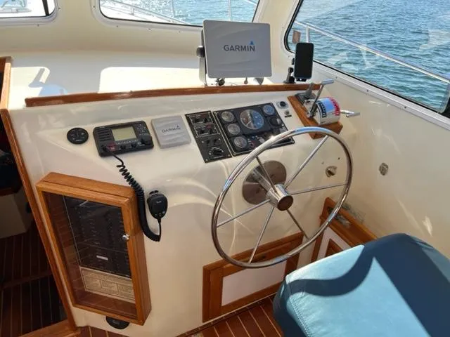Slide: The Image of Helm of 2000 Duffy 35 Hardtop Cruiser with Garmin navigation system. - 24