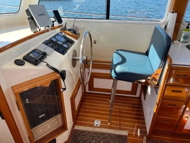 Slide: The Image of Interior of a 2000 Duffy 35 Hardtop Cruiser with helm station. - 25