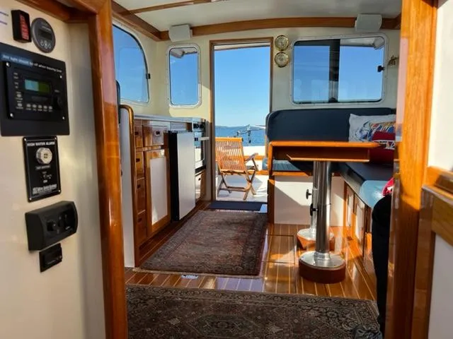 Slide: The Image of Interior of a 2000 Duffy 35 Hardtop Cruiser with wooden furnishings. - 29