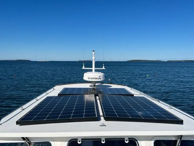 Slide: The Image of Duffy 35 Hardtop Cruiser with solar panels on the sea, year 2000. - 33