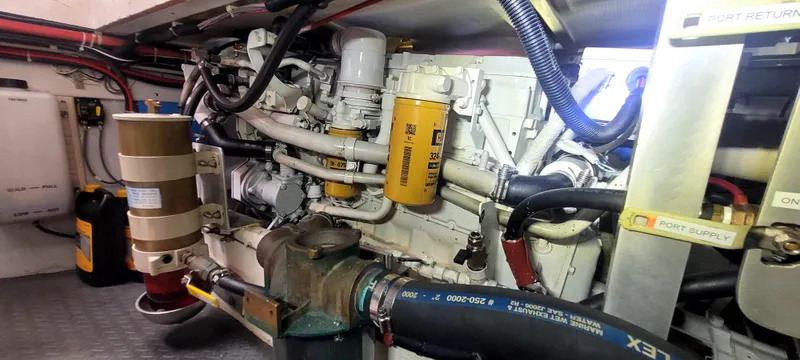 Slide: The Image of Engine room of 2000 Duffy 35 Hardtop Cruiser with hoses and filters. - 37