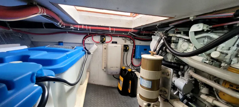 Slide: The Image of Engine room of 2000 Duffy 35 Hardtop Cruiser with blue batteries. - 41