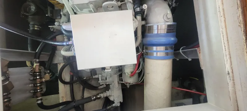 Slide: The Image of Engine room of a 2000 Duffy 35 Hardtop Cruiser with hoses and cables. - 44