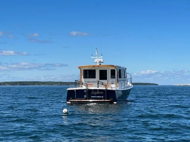 Slide: The Image of 2000 Duffy 35 Hardtop Cruiser on open water. - 47
