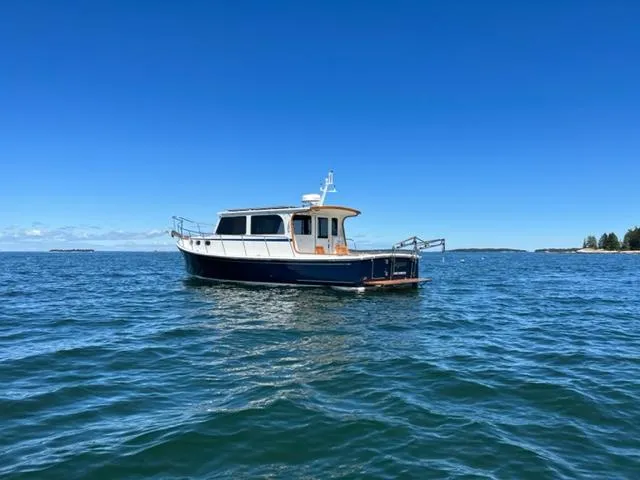 Slide: The Image of 2000 Duffy 35 Hardtop Cruiser on open sea. - 48
