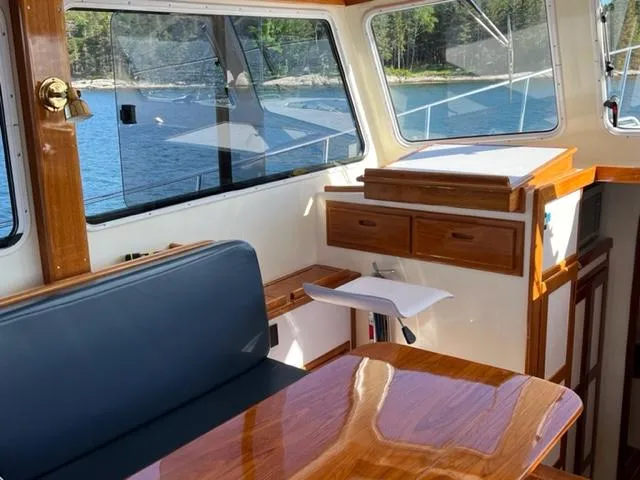 Slide: The Image of Interior of a 2000 Duffy 35 Hardtop Cruiser with wooden furnishings. - 6