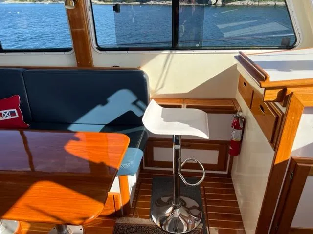 Slide: The Image of Interior of a 2000 Duffy 35 Hardtop Cruiser with seating area. - 8