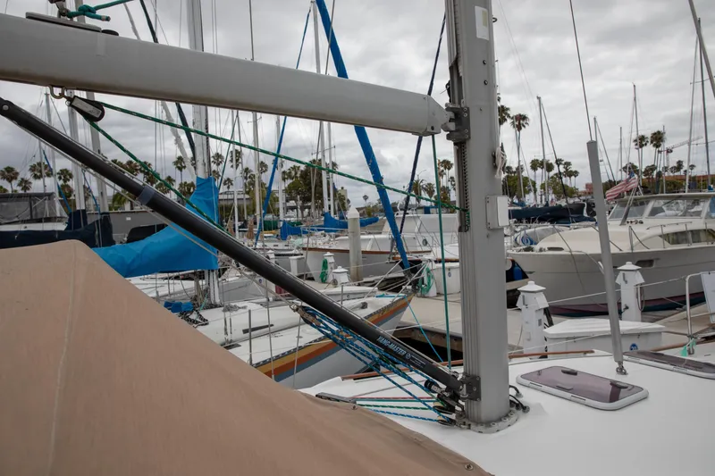 Slide: The Image of 1999 Beneteau Oceanis 36 CC sailboat docked in a marina, surrounded by other boats. - 20