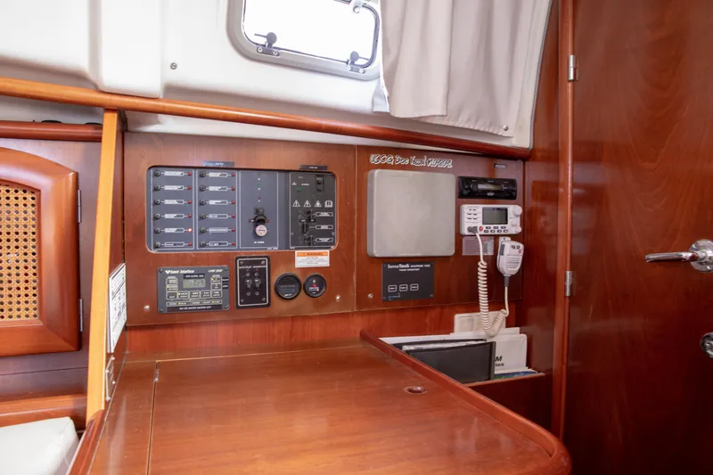 Slide: The Image of Interior view of 1999 Beneteau Oceanis 36 CC sailboat control panel and navigation equipment. - 30