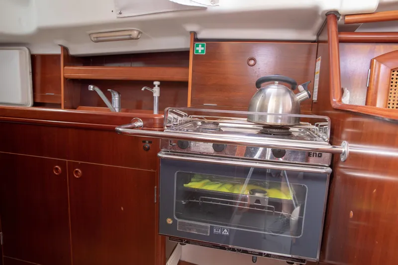 Slide: The Image of Interior of 1999 Beneteau Oceanis 36 CC yacht kitchen with stove and kettle. - 39