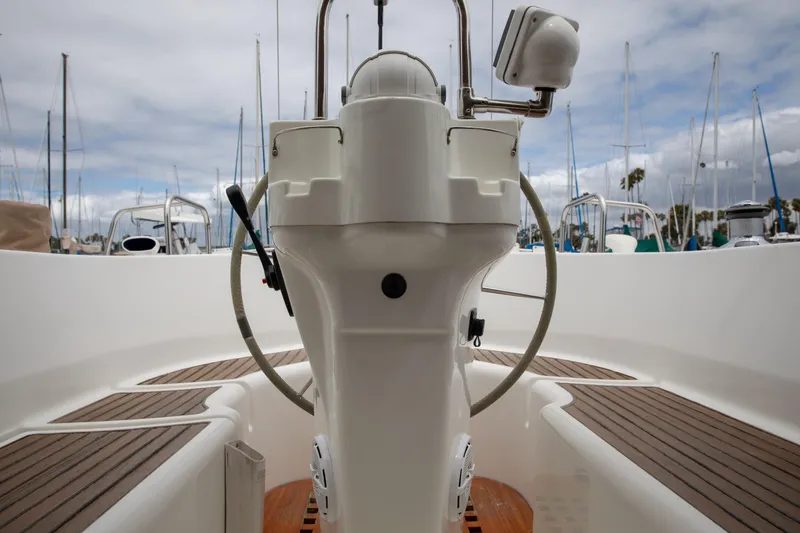 Slide: The Image of Cockpit view of 1999 Beneteau Oceanis 36 CC sailboat with steering wheel and wooden deck. - 51
