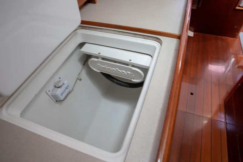 Slide: The Image of Beneteau Oceanis 36 CC 1999 yacht interior with open storage compartment. - 52