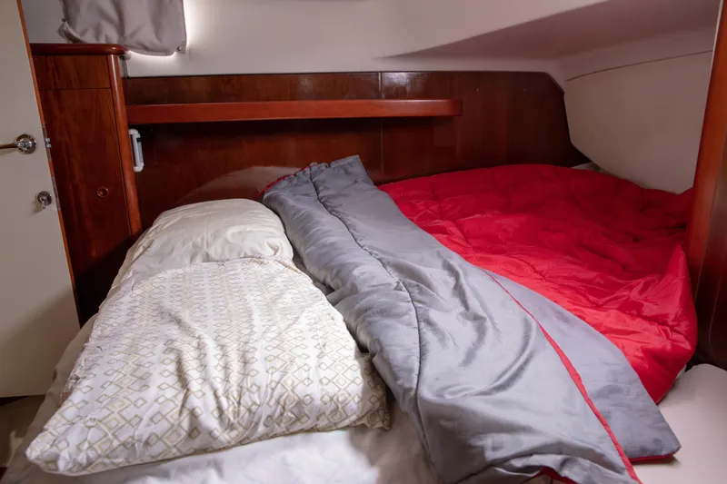 Slide: The Image of Cozy cabin interior of 1999 Beneteau Oceanis 36 CC sailboat with comfortable bedding. - 54