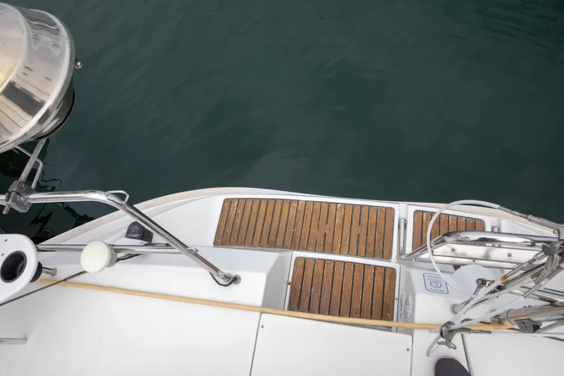 Slide: The Image of Deck view of 1999 Beneteau Oceanis 36 CC sailboat with wooden flooring. - 57