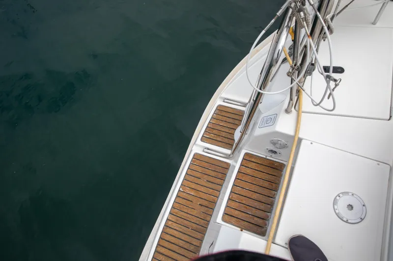 Slide: The Image of Deck view of a 1999 Beneteau Oceanis 36 CC sailboat with teak flooring. - 59