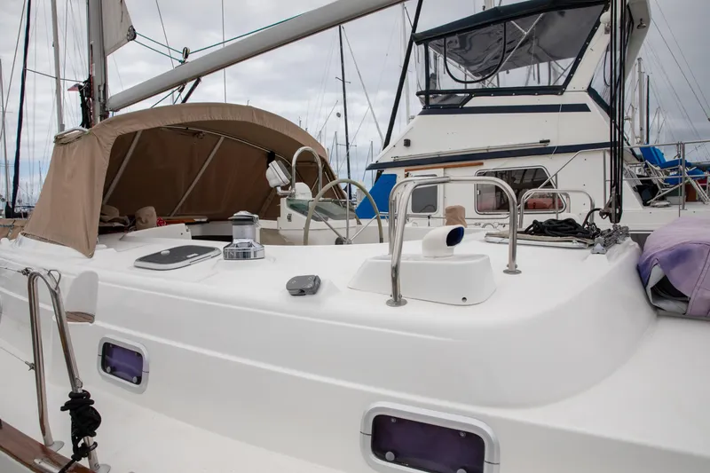 Slide: The Image of 1999 Beneteau Oceanis 36 CC sailboat with beige canopy, docked in marina. - 7