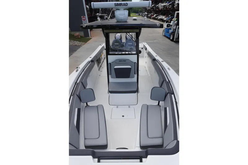 Slide: The Image of 2025 Sea Pro 292 DLX boat interior with seating and navigation equipment. - 10