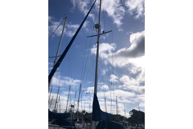 Slide: The Image of Sailboat mast of a 2000 Catalina 36 MkII against a cloudy sky. - 12