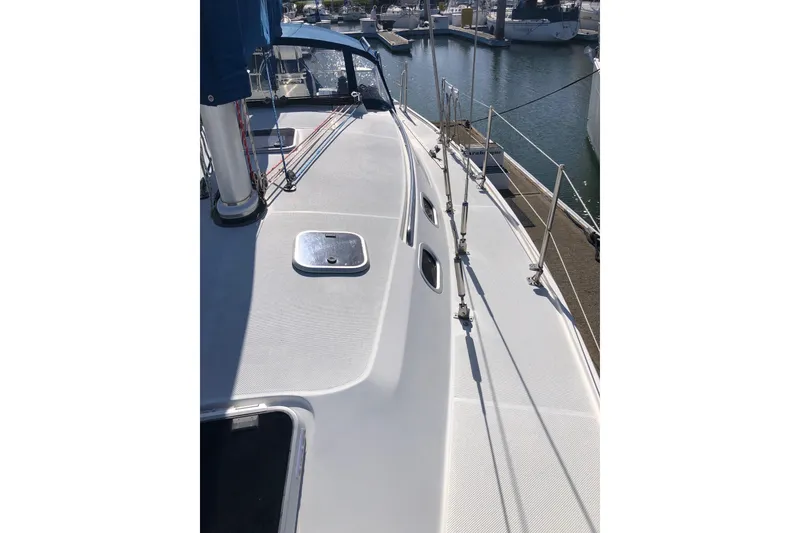 Slide: The Image of Catalina 36 MkII 2000 sailboat deck view at marina, showcasing sleek design and rigging. - 18