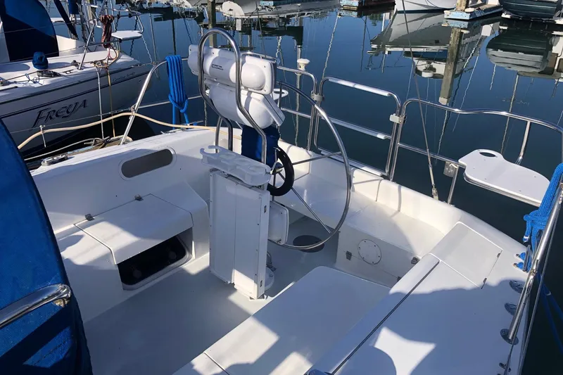 Slide: The Image of Cockpit of a 2000 Catalina 36 MkII sailboat, docked in a marina. - 19