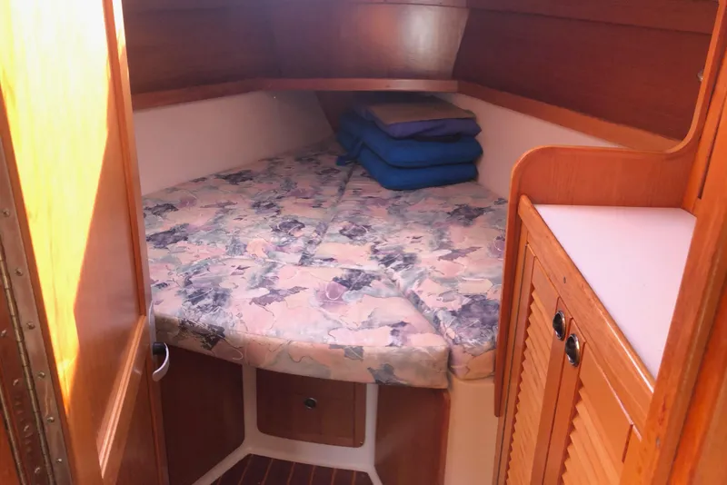 Slide: The Image of Cozy cabin interior of 2000 Catalina 36 MkII sailboat with floral bedding. - 7