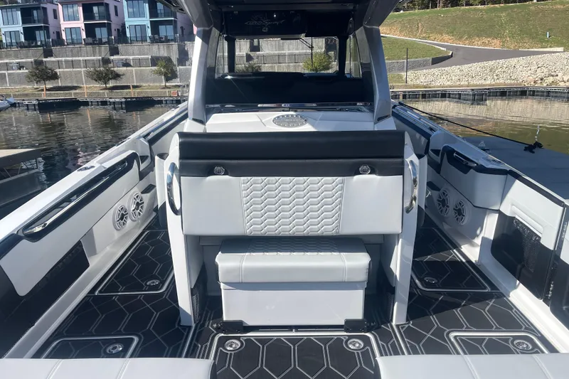 Slide: The Image of 2025 Nor-Tech 450 Sport Center Console boat interior with modern seating and sleek design. - 23