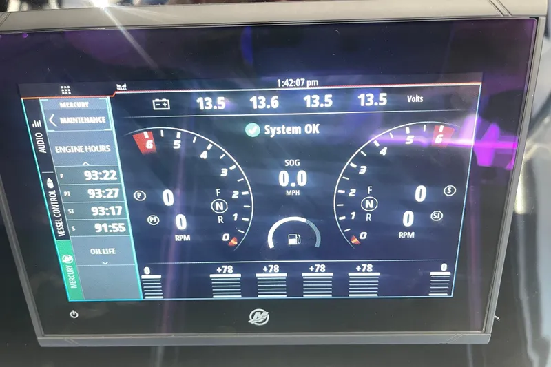Slide: The Image of Dashboard display of 2025 Nor-Tech 450 Sport Center Console showing engine metrics. - 33