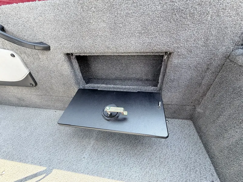 Slide: The Image of 2017 Tracker Targa V-18 Combo boat compartment with lock. - 14