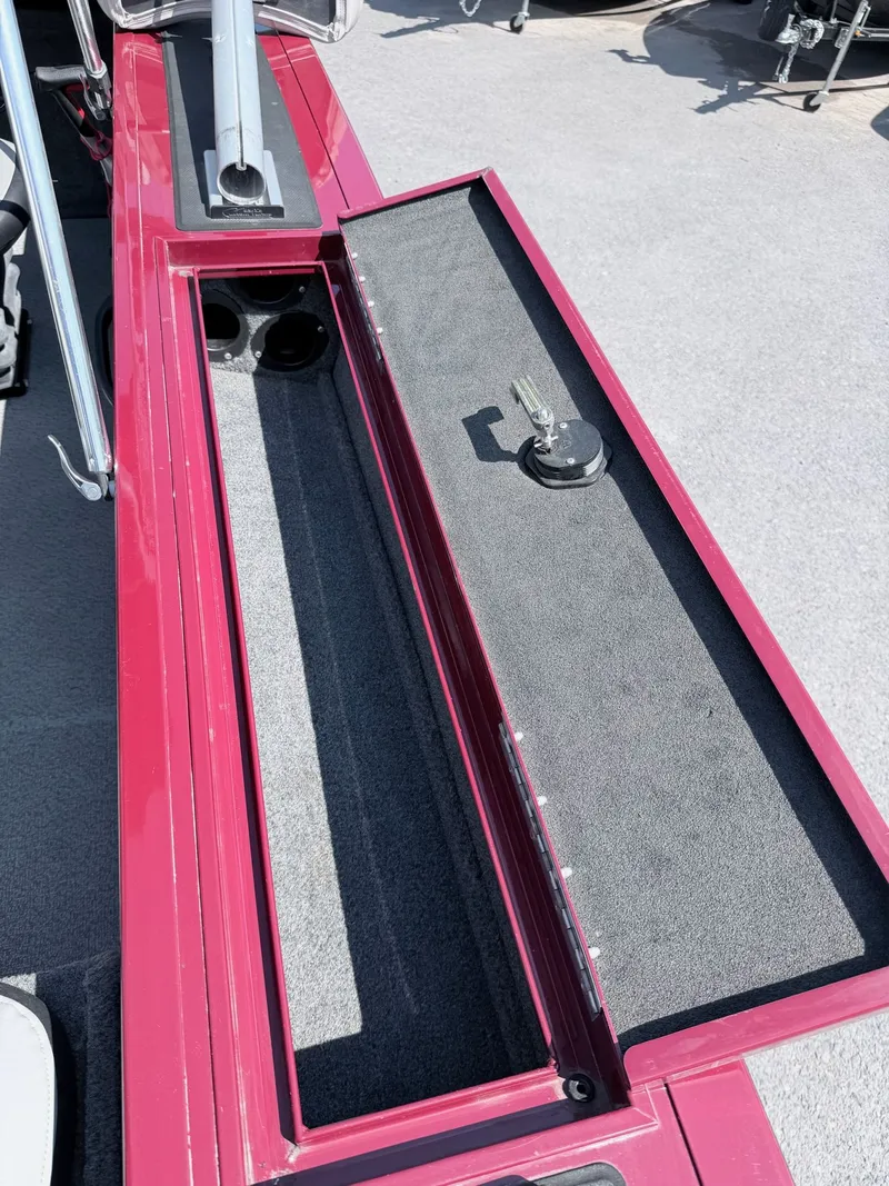 Slide: The Image of 2017 Tracker Targa V-18 Combo boat with open storage compartment. - 19