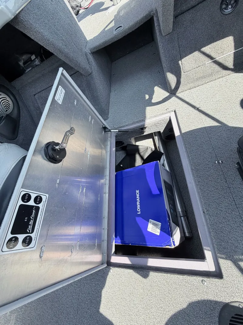 Slide: The Image of 2017 Tracker Targa V-18 Combo boat with storage compartment and Lowrance device. - 20