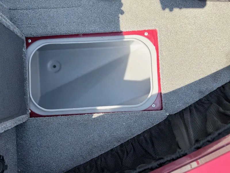 Slide: The Image of 2017 Tracker Targa V-18 Combo boat hatch with gray carpet. - 21