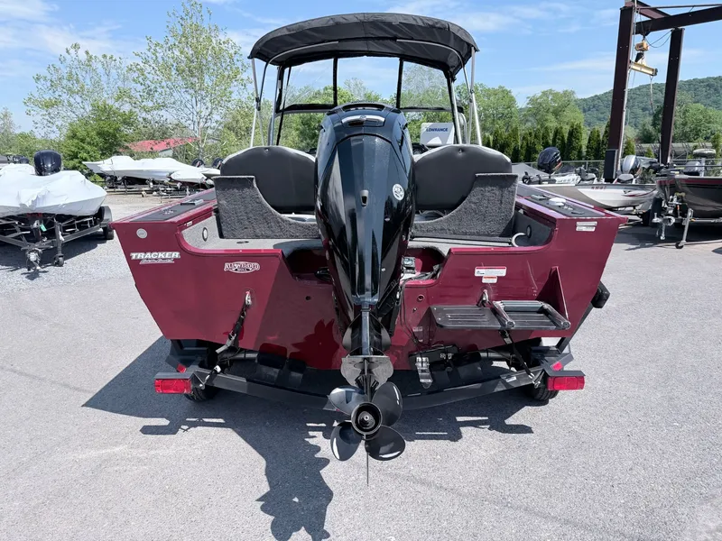 Slide: The Image of Rear view of a 2017 Tracker Targa V-18 Combo boat outdoors. - 24