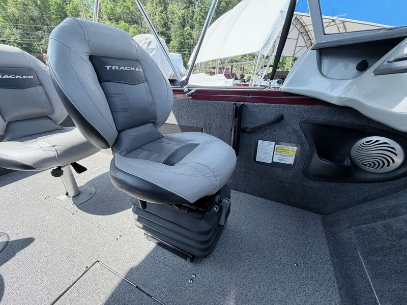 Slide: The Image of Interior of a 2017 Tracker Targa V-18 Combo boat with gray seats. - 27