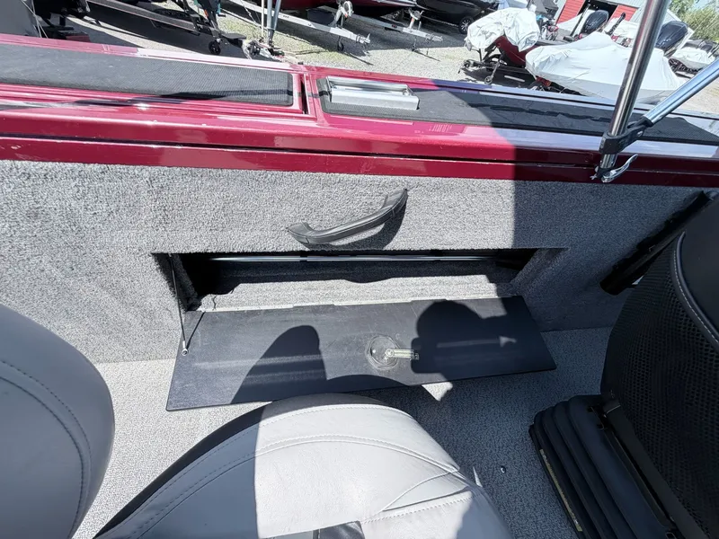 Slide: The Image of Interior of a 2017 Tracker Targa V-18 Combo boat with storage compartment. - 3