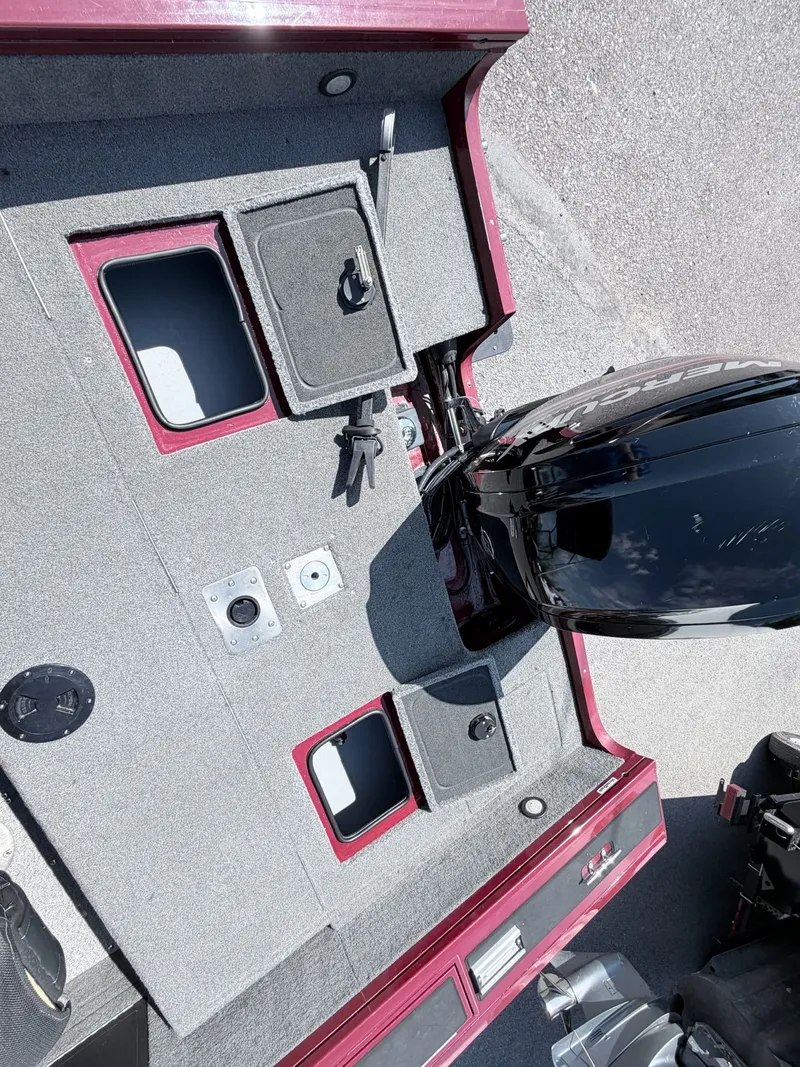Slide: The Image of 2017 Tracker Targa V-18 Combo boat with motor and storage compartments. - 36