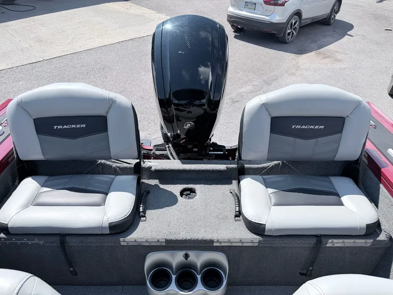 Slide: The Image of 2017 Tracker Targa V-18 Combo boat rear with motor and seats. - 7