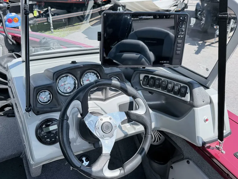 Slide: The Image of 2017 Tracker Targa V-18 Combo boat console with steering wheel and instruments. - 8
