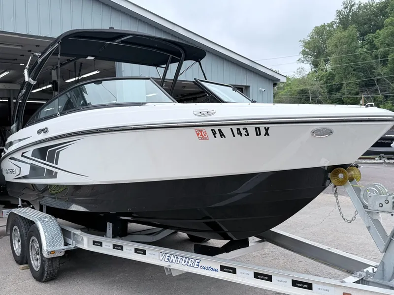 Slide: The Image of 2020 Monterey M-20 boat on trailer in front of garage. - 22