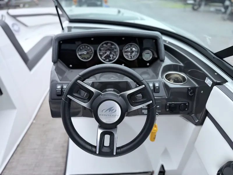 Slide: The Image of Steering wheel and dashboard of a 2020 Monterey M-20 boat. - 38