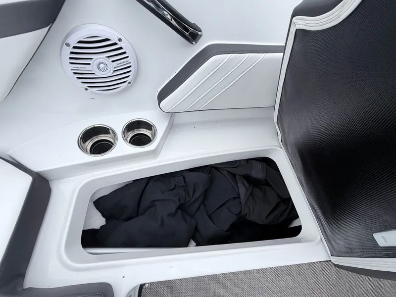 Slide: The Image of Monterey M-20 boat, speaker and storage compartment with clothing. - 39