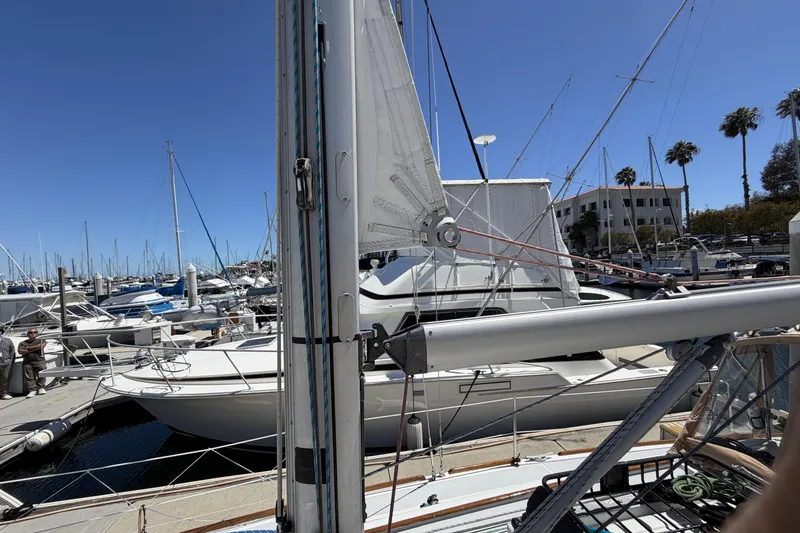Slide: The Image of Beneteau Oceanis 37 sailboat docked at marina, clear blue sky, 2010 model. - 11