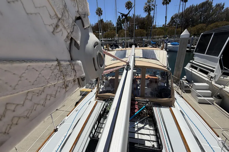 Slide: The Image of Beneteau Oceanis 37 sailboat docked, showcasing deck and rigging, 2010 model. - 12