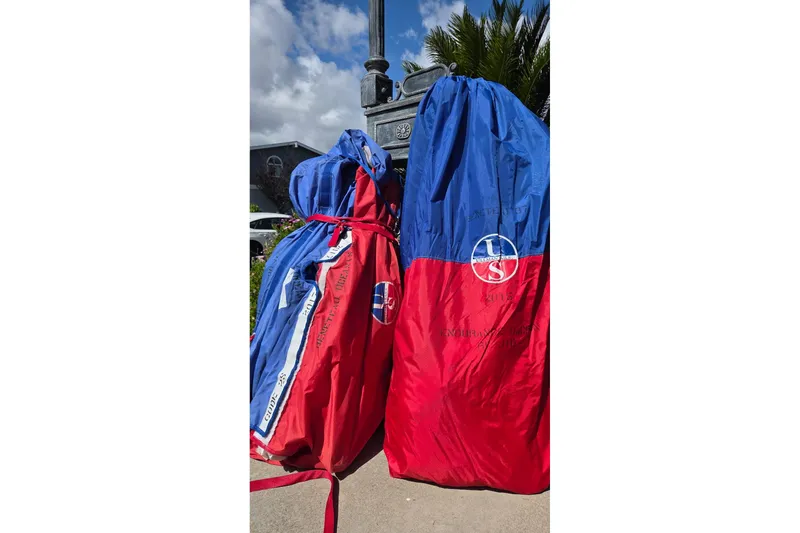 Slide: The Image of Red and blue sail bags on pavement, suitable for Beneteau Oceanis 37, 2010 model. - 13