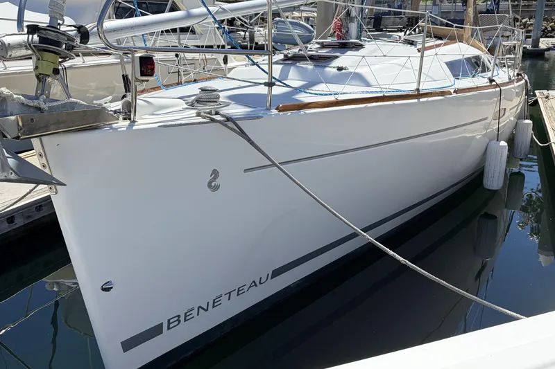 Slide: The Image of 2010 Beneteau Oceanis 37 sailboat docked in marina, side view. - 2