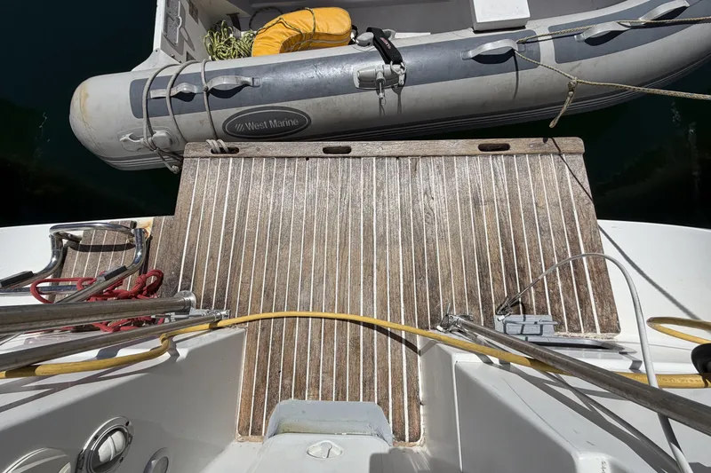 Slide: The Image of Teak deck of 2010 Beneteau Oceanis 37 with inflatable dinghy alongside. - 22
