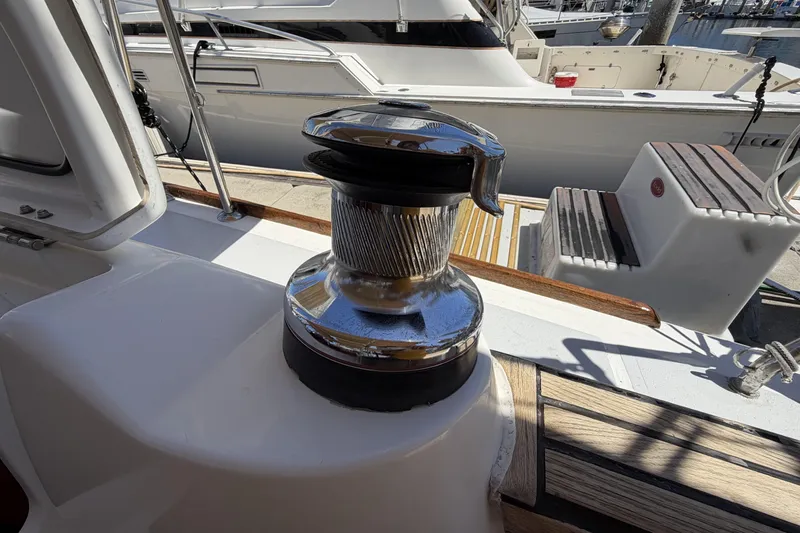 Slide: The Image of Winch on 2010 Beneteau Oceanis 37 sailboat deck, docked at marina. - 31
