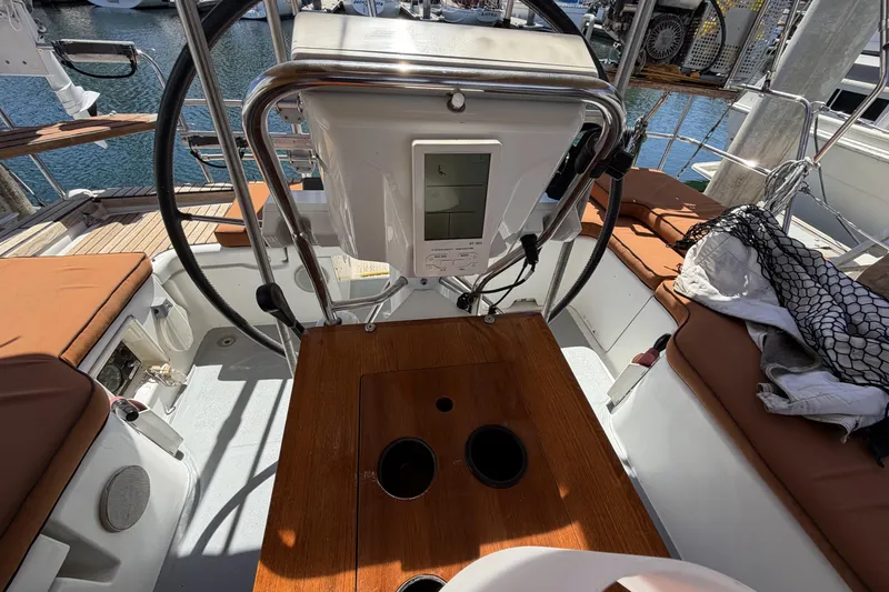 Slide: The Image of Cockpit of 2010 Beneteau Oceanis 37 sailboat with steering wheel and navigation equipment. - 36